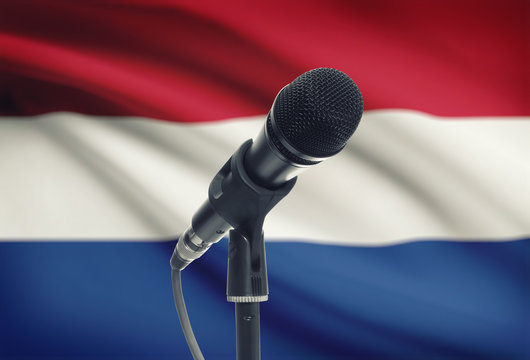 Microphone on stand with national flag on background - Netherlands