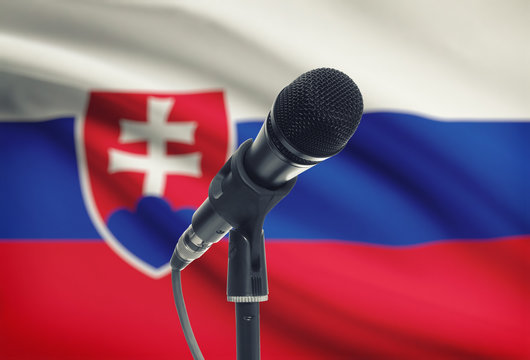 Microphone on stand with national flag on background - Slovakia
