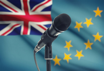 Microphone on stand with national flag on background - Tuvalu
