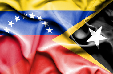 Waving flag of East Timor and Venezuela