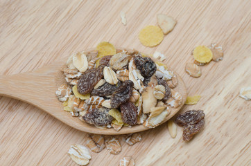Oat flakes in wooden spoon