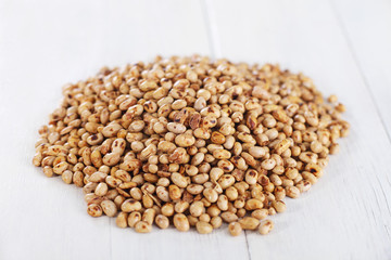 Soybean seeds on old kitchen table 