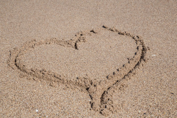 heart drawn on sand
