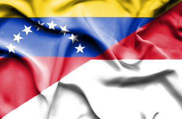 Waving flag of Monaco and Venezuela