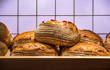 Fresh hot bread on the wooden shelf