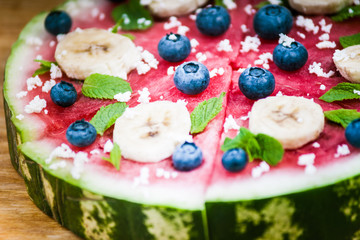 Watermelon pizza on wood