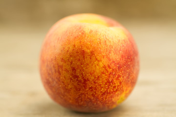 ripe fresh peaches on wooden background