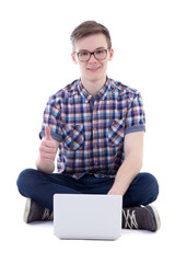 handsome teenage boy using laptop and thumbs up isolated on whit