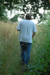 man walking in the woods