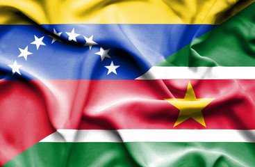 Obraz premium Waving flag of Suriname and Venezuela