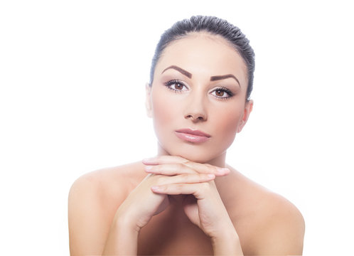 Beautiful woman with clean face, healthy skin. Isolated on white background, studio shot. Portrait of a young beauty girl