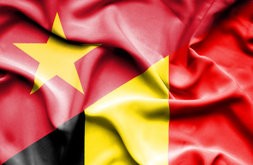 Waving flag of Belgium and Vietnam