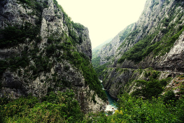 mountain landscape in Europe river gorge clouds