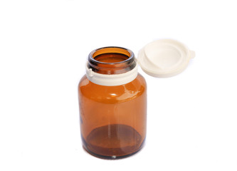 Yellow bottle of medicine isolated on white background.