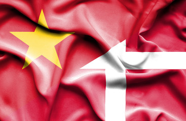 Waving flag of Denmark and Vietnam