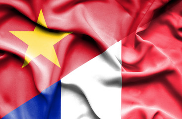Waving flag of France and Vietnam