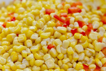 Closeup of tinned whole kernel corn and carrots, it could be use