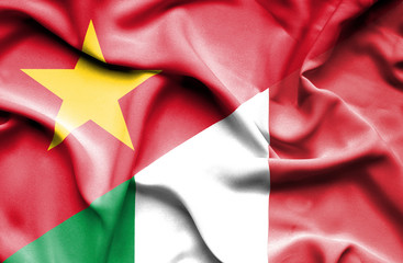 Waving flag of Italy and Vietnam