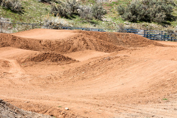 Fototapeta premium Empty cyclocross track with the bumpy dirt course