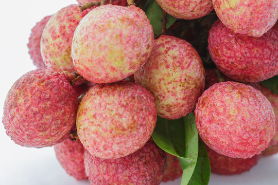Fresh lychees bunch on white background