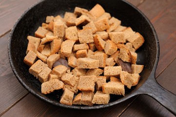 Roasted rye bread in black cast iron pan