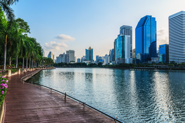 Naklejka premium The landscape urban park with water and buildings in Bangkok.