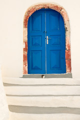 Colorful blue door of traditional house in Fira, Santorini