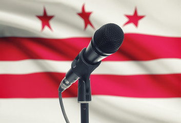 Microphone on stand with US state flag on background - District of Columbia