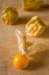 Phys alis, or Cape Gooseberry fruit on the wooden background
