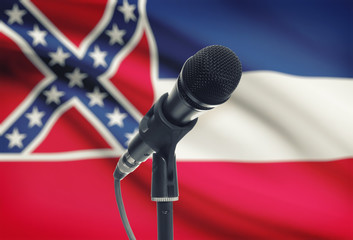 Microphone on stand with US state flag on background - Mississippi