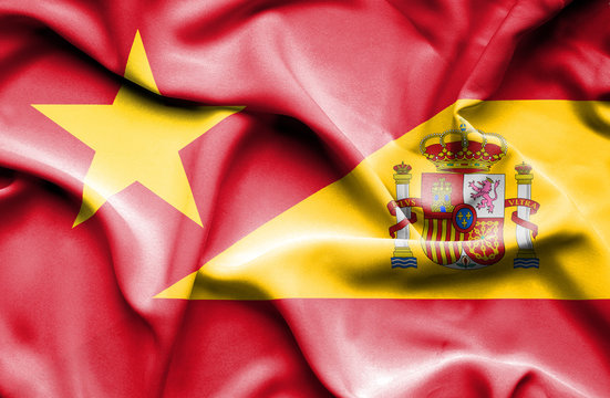 Waving flag of Spain and Vietnam