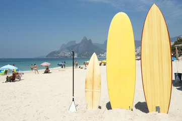 Surfboards and stand up paddle boards line up on the beach at Arpoador, Ipanema, Rio de Janeiro...