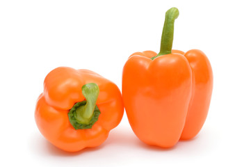Ripe Bulgarian peppers on white background.