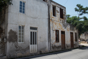 Abandoned house in the street in Greece
