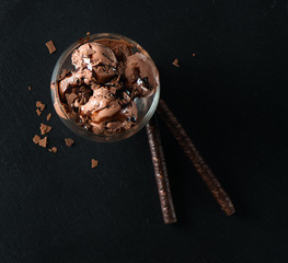 Chocolate ice cream with wafer sticks, view from above