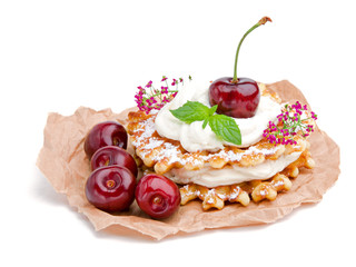 Golden waffle with cream and berries