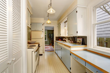 Traditional kitchen with tile floor, in boho chic house.