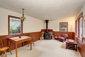 Simple room with fireplace, and chair.