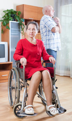 sad invalid  woman and senior man.