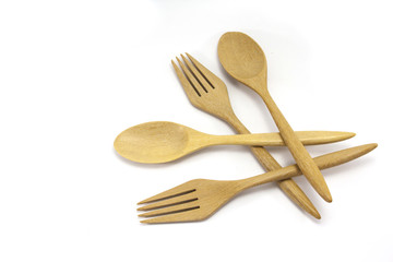 Wooden fork and spoon on a white background