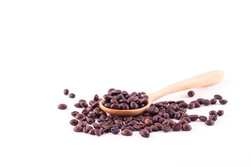 Spread coffee seeds on wooden spoon isolated on white background