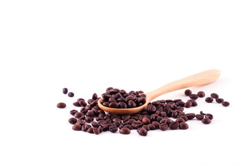 Spread coffee seeds on wooden spoon isolated on white background