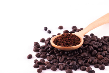 Fototapeta na wymiar Coffee beans and ground coffee on wooden spoon isolated on white
