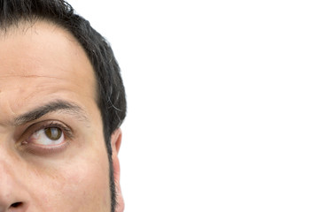 Fototapeta premium Closeup on upper part of males face looking up isolated on white