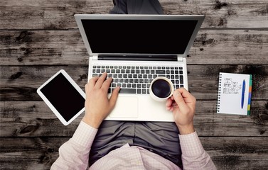 Laptop, desk, phone.