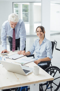 Confident businesswoman in wheelchair