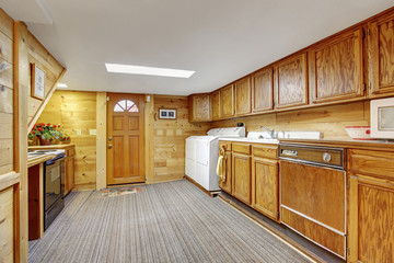 Authentic kitchen laundry room combo with carpet.