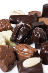 various chocolates on white background - sweet food