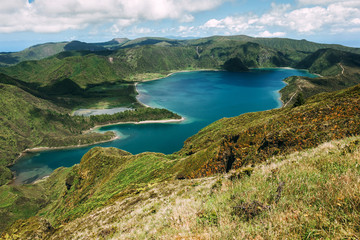 Fototapeta na wymiar Panoramic view of Lagoa do Fogo, a crater lake within the Agua de Pau Massif stratovolcano in the center of the island of Sao Miguel in the Portuguese archipelago of the Azores.
