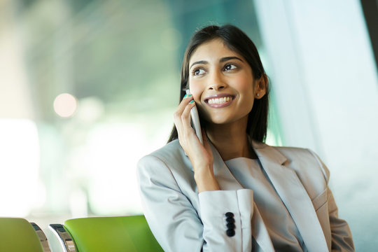 indian business woman talking on mobile phone
